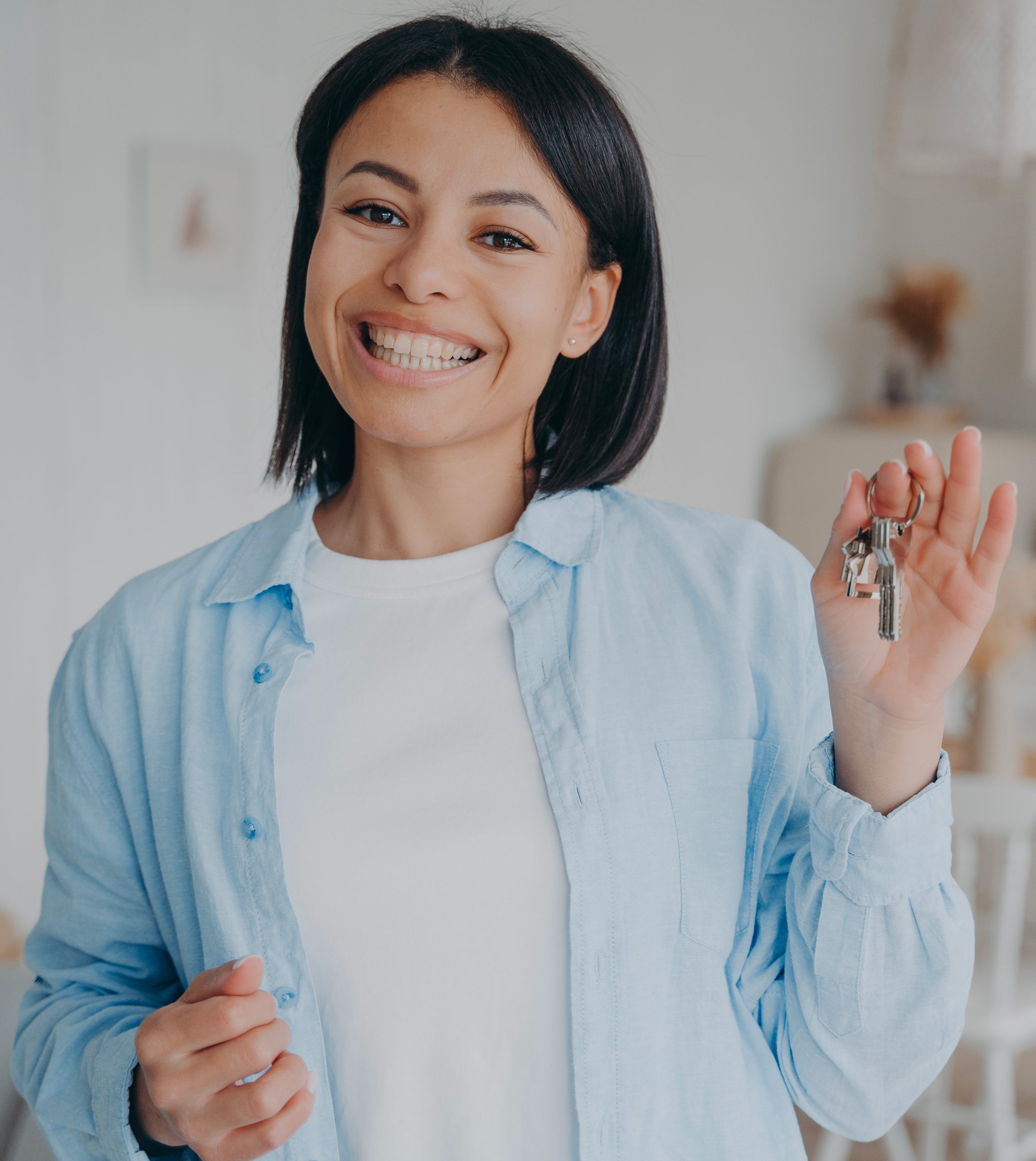 smiling-woman-showing-holding-keys-to-new-house-r-2022-08-02-00-54-32-utc